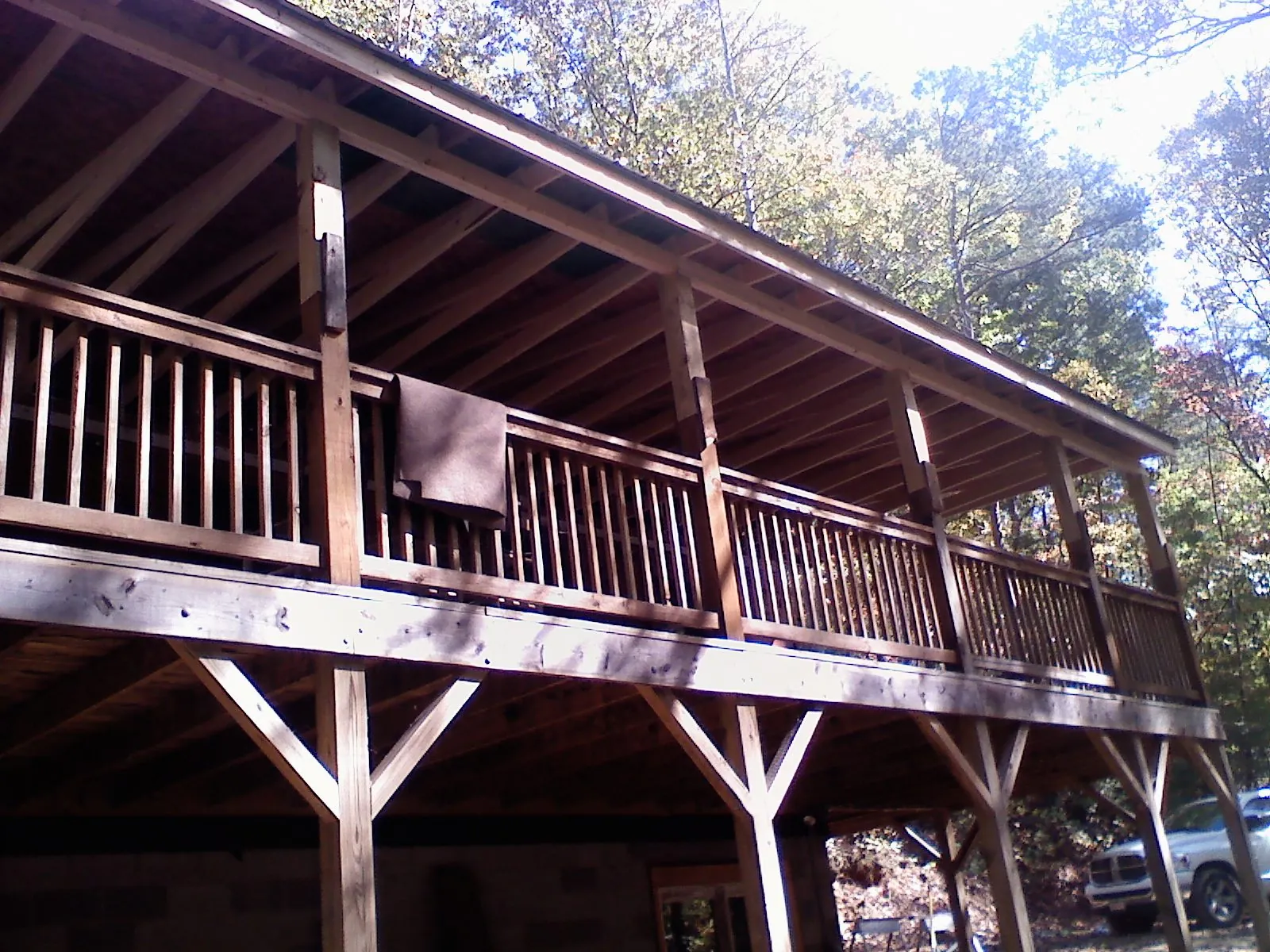 Timber framing under a new elevated porch and deck — Roof Leak Repair in Ludington by Roofing Brothers